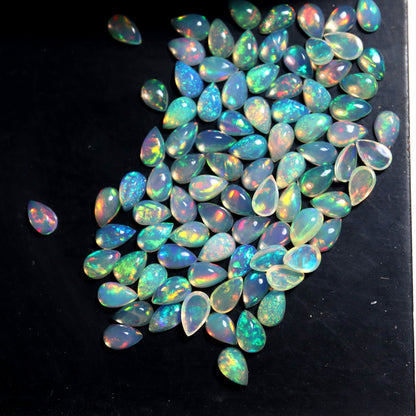 Gorgeous Multi Play Fire Ethiopian Opal 5x8 mm Pear Cabochon, Natural Ethiopian Opal Multi Fire Opal Cabochon, Loose Opal Cabochon Gemstone. (Natural)