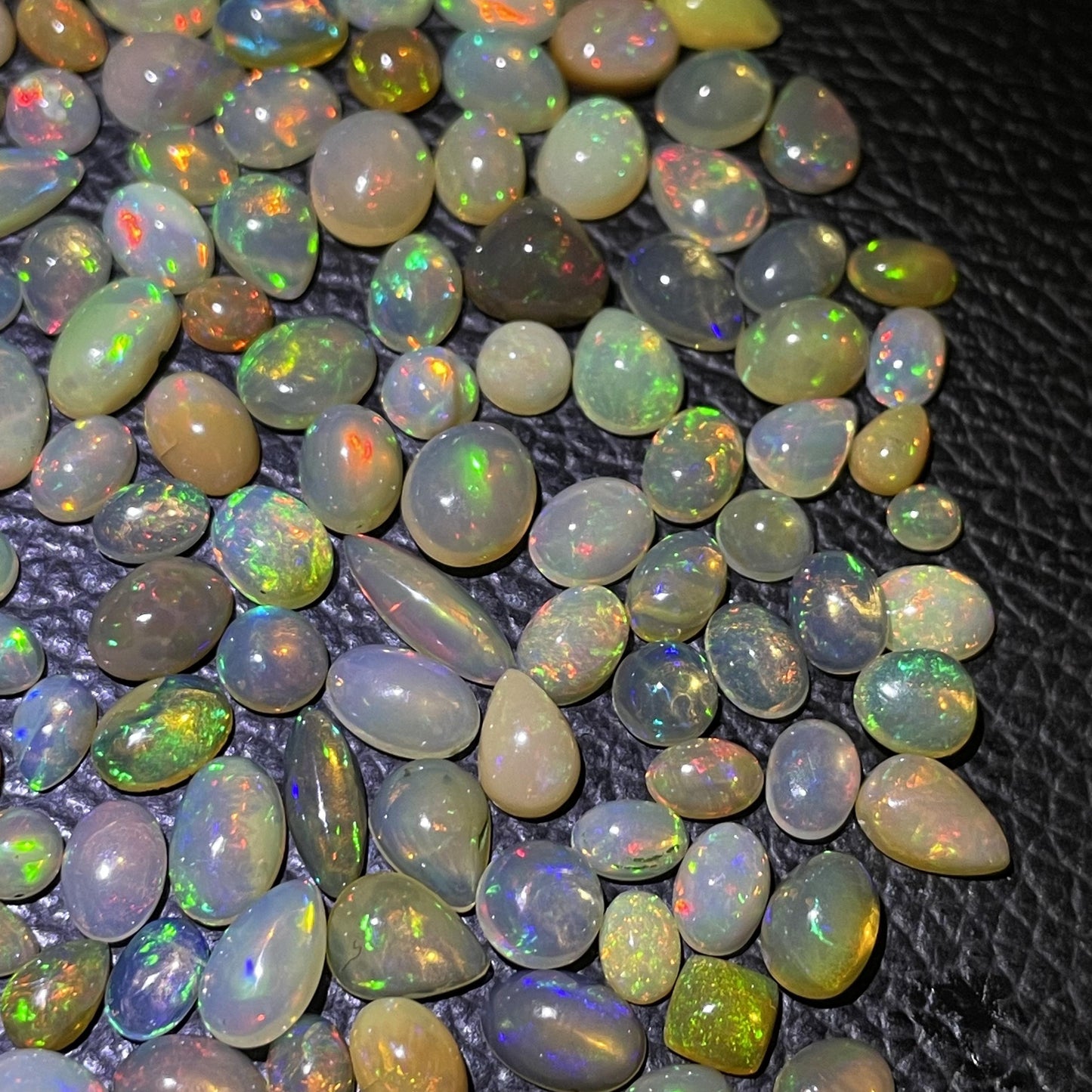Unleash Your Creativity with the Mesmerizing Beauty of Handcrafted Ethiopian Opal Mix Size and Shape Cabochons - Exquisite Gems for Discerning Jewelry Designers and Collectors
